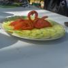 Amazing tomato birds carved by our tour guide to decorate this plate of cucumbers