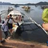 We had to balance along this wooden plank, cross through two more boats and take a kayak just to get to our reserved boat!