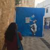 My friend, Alia, walking towards a beautiful mural in Asilah