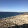 Erosion happens when sand gets pushed away and the dune gets flattened out, such as through driving