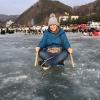 Traditional ice sledding: you use a wooden slate set onto blades and two metal pics on sticks