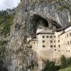 Predjama Castle, the largest castle on earth, built into a cave and home to Slovenia's own Robin Hood, the knight Erasmus 