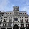 The clock overlooking St. Mark's square features the symbol of the city of Venice on the top— the winged lion of St. Mark