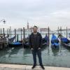 Me in front of some gondolas, which are special boats Venetians use to maneuver through the canals 