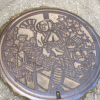 A manhole decorated with samurai