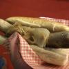 Many vendors sell traditional German bratwursts with sauerkraut and onions