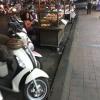 Food stalls are often surrounded by the mopeds of individuals trying to satisfy their hunger