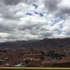 The view of the city from on top of a nearby mountain