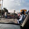 You often see street performers like this one performing for cars stopped in traffic
