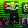 Paintings of salsa icons, including Celia Cruz, a Cuban singer