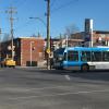 A blue Montreal city bus on its route past my apartment