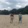 Ashley and Mayra walking across a beach where swimming is not allowed because the waves are too rough-we had 45 minutes left!