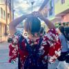 My friend Mayra walking through the colorful streets of Guatape, a town that's two hours away from Medellín and home to the "Rock of Peñol"