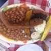 This is called a "Bandeja Paisa;" it is the typical dish of Medellín. It has three different types of meat, beans, avocado, arepa and plantain