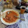 This is a soup called "Borsh." It's the most popular soup in Russia -- kind of like chicken noodle soup in the U.S.! Everyone makes it differently, but it usually has beets, cabbage, potatoes, tomato paste and onions in it. Sour cream makes it creamy!