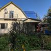 This is the "dacha" itself! It's a pretty newly built house, but you can see the older, original part on the right, which is like a traditional Russian log cabin.