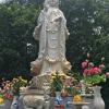 A statue located at the entrance to the silk village. 