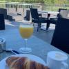 This is a croissant with fresh orange juice, and although not a specifically German dish, this photo shows how popular it is to have a nice relaxing breakfast outside!