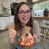 Here I am eating Spaghetti Eis, or "spaghetti ice cream!" The "noodles" are vanilla ice cream, the "red sauce" is strawberry sauce, and the "cheese" is white chocolate