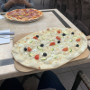 This is "flammkuchen", which is sort of like pizza, but instead of having tomato sauce, it has feta cheese, olives, tomatoes, spinach and lots of garlic