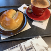 This is a fluffy bread in the shape of a horn, with a sweet butter coating on the outside--with coffee too of course!