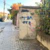Graffiti can be found anywhere: this is down a residential street in Prishtina