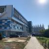 The Palace of Youth and Sports is right next to the futbol stadium