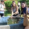 My friend and I collecting water from a turtle fountain statue.