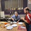 When the food was finally ready, we were shown how to arrange it nicely on a plate—here, my sister and I are working on adding the sauce