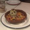 Creme Brulee with pistachio ice cream and pomegranate seeds