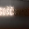 This neon sign was part of an art exhibit at the Modern Art Museum. In Polish, Gość means guest, Inność means difference and Gośćinność means to host a guest. It comments on the political hostility towards difference throughout the world and in Poland.