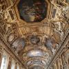 One of the many beautiful ceilings in the Louvre Museum. Few people know that, even before this sort of ornamentation was added, the Louvre was originally a fortress completed by King Philip II in 1202.