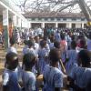 This is how Nailah's school prepares for the day, including live drumming, songs and words of encouragement. The girls are required to cut their hair and wear uniforms while in school.