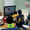 Piloting the ROV with judges looking on