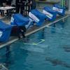 Students placing their ROV through the ice hole