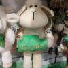 Toy sheep holding shamrock