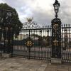 A royal Greenwich lamppost with an important job of lighting the gateway