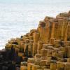 This is the unique rock formations called basalt columns formed from the rapid cooling of an underwater volcano a very long time ago; this is Giant’s Causeway