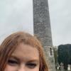 A picture of me in front of the Round Tower in the monastic site in Glendalough, County Wicklow
