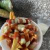 Salcipapas, which are fries and sausage, served with coconut juice