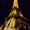 The Eiffel Tower glowing radiantly at night