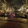 Many streets in Amsterdam have trees covered in lights