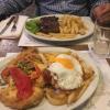 Typical Argentine dinners: a milanesa (fried, breaded meat) and steak served with French fries (June 2018)