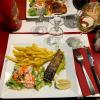 Salmon and fries, as you will see most restaurant meals are served with fries!