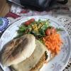 A sandwich made with "bolo de caco", a traditional Madeiran bread