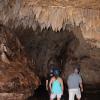 Stalactites hanging from the ceiling of a cave