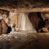 While there are stalactites hanging from the ceiling, stalagmites grow from the cave floor