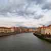 The Arno River at sunset with the 800 year old little white chapel of Santa Maria della Spina on the right