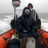 Jessie on a boat in stormy weather