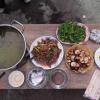 I ate mushrooms, wild greens and chicken in a local village